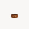 Arvak + Sól cuff bracelet in saddle leather with adjustable metal clasp, featuring a sleek and minimalist design.