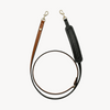 Arvak + Sól hands-free cross body leash in saddle brown and black, adjustable dog leash with secure strap for convenient walking.