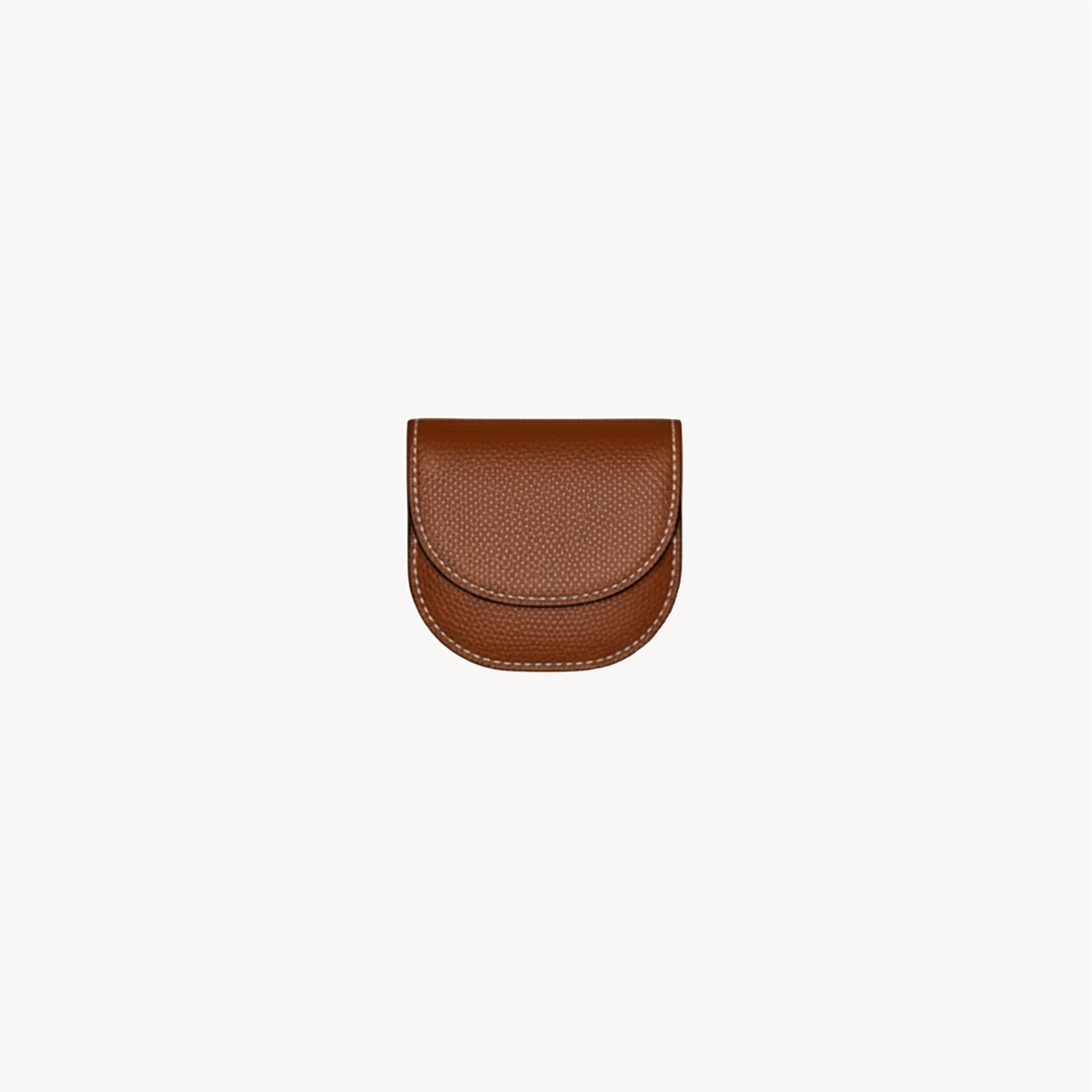 Folding waste bag holder from Arvak + Sól in saddle brown, designed for convenient pet waste disposal.