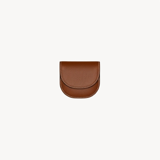 Folding waste bag holder from Arvak + Sól in saddle brown, designed for convenient pet waste disposal.