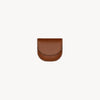 Folding waste bag holder from Arvak + Sól in saddle brown, designed for convenient pet waste disposal.
