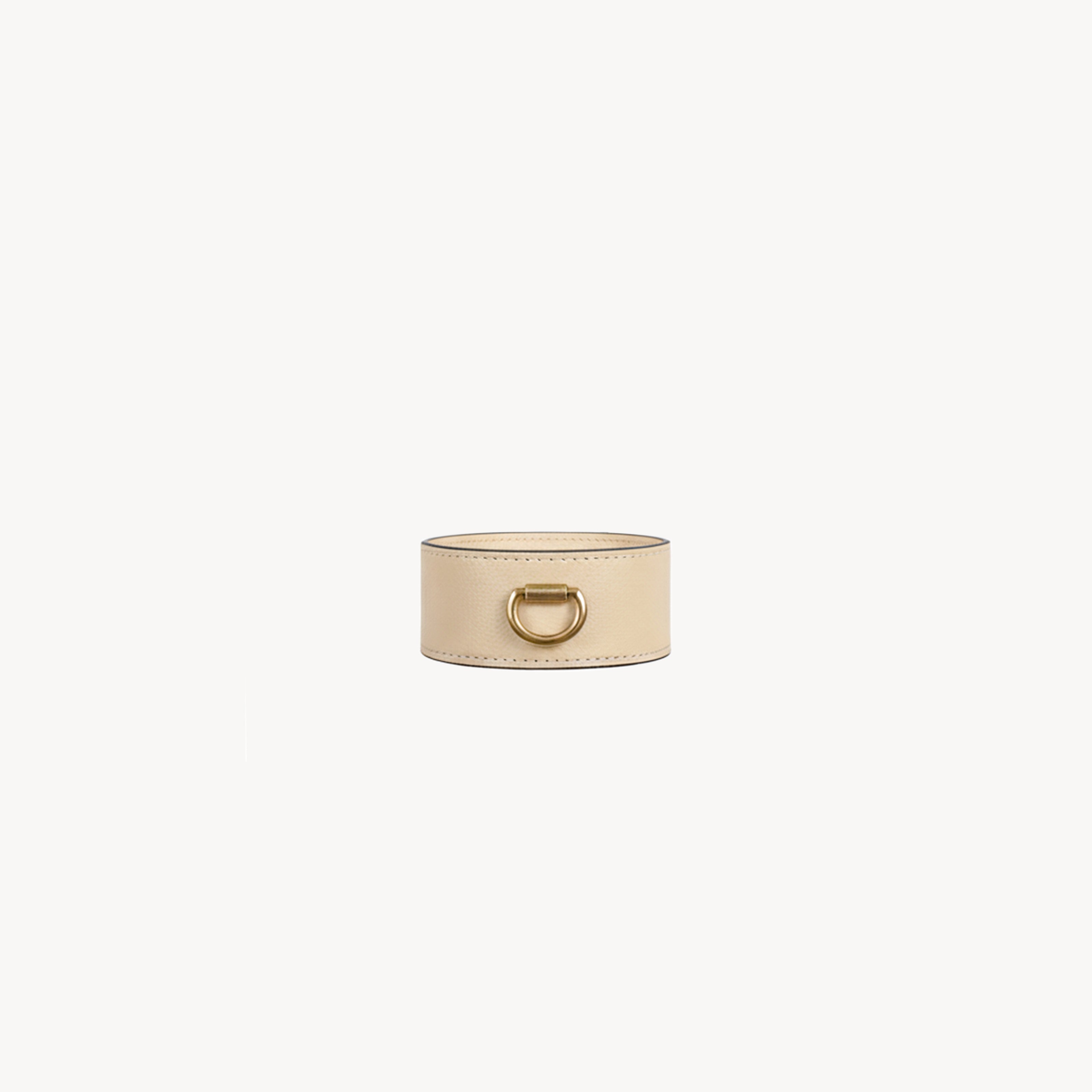 Cream cuff bracelet by Arvak + Sól featuring a sleek, minimalist design and smooth finish visible in the image.