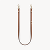 Double-ended leather leash by Arvak + Sól in saddle brown, featuring sturdy metal clasps and durable leather construction.