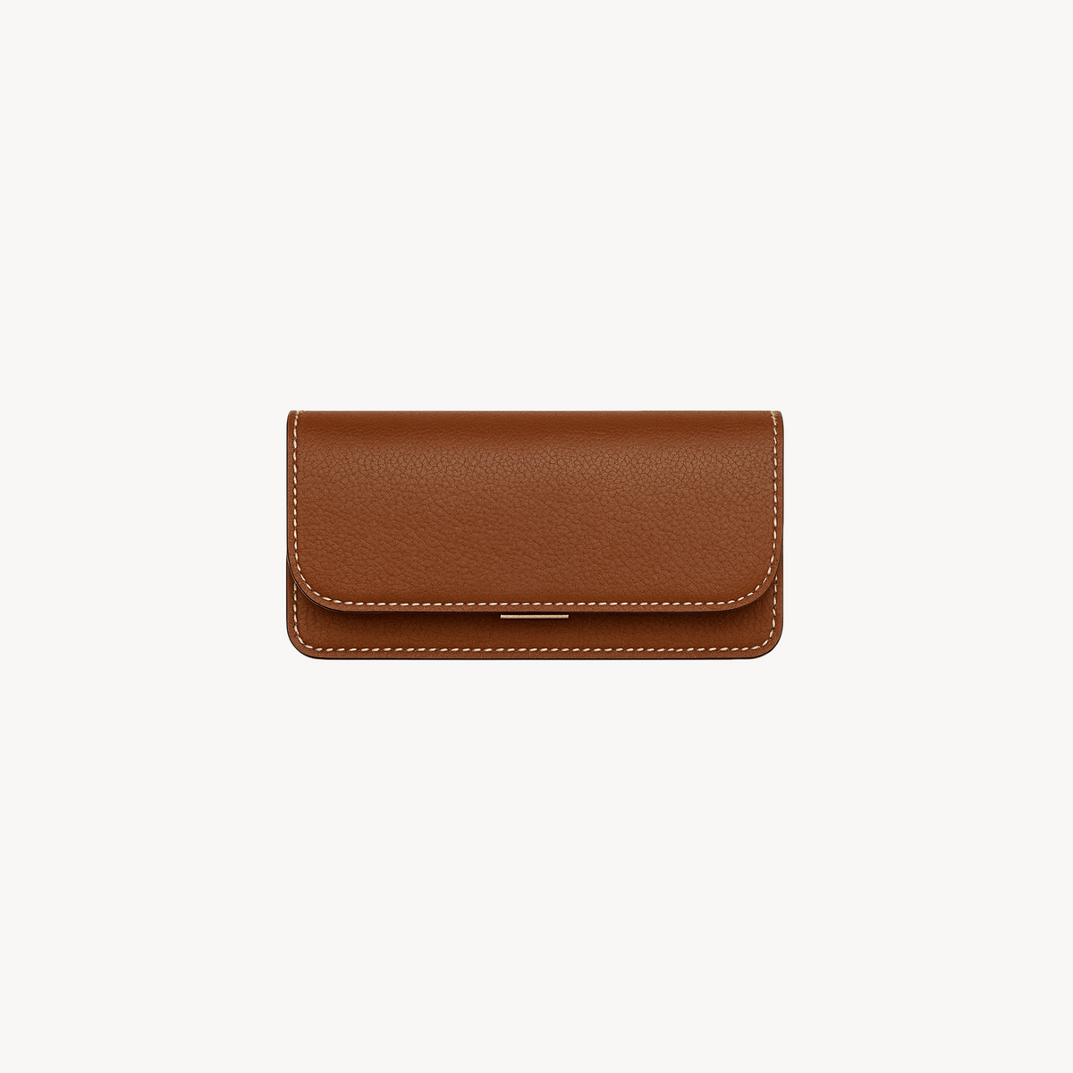 Mini Flap Bag by Arvak + Sól in saddle brown leather, featuring a compact design with a flap closure and adjustable strap.