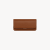 Mini Flap Bag by Arvak + Sól in saddle brown leather, featuring a compact design with a flap closure and adjustable strap.