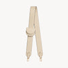 Cream-colored bag strap and folding wallet set by Arvak + Sól, featuring stylish, textured leather accessories.
