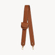 Arvak + Sól bag strap and folding wallet set with a saddle leather finish, featuring adjustable strap and compact wallet design.