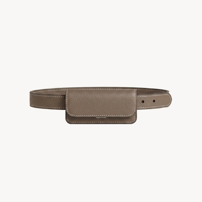 Taupe Arvak + Sól belt bag with mini flap design, featuring a compact, stylish accessory for hands-free carrying.