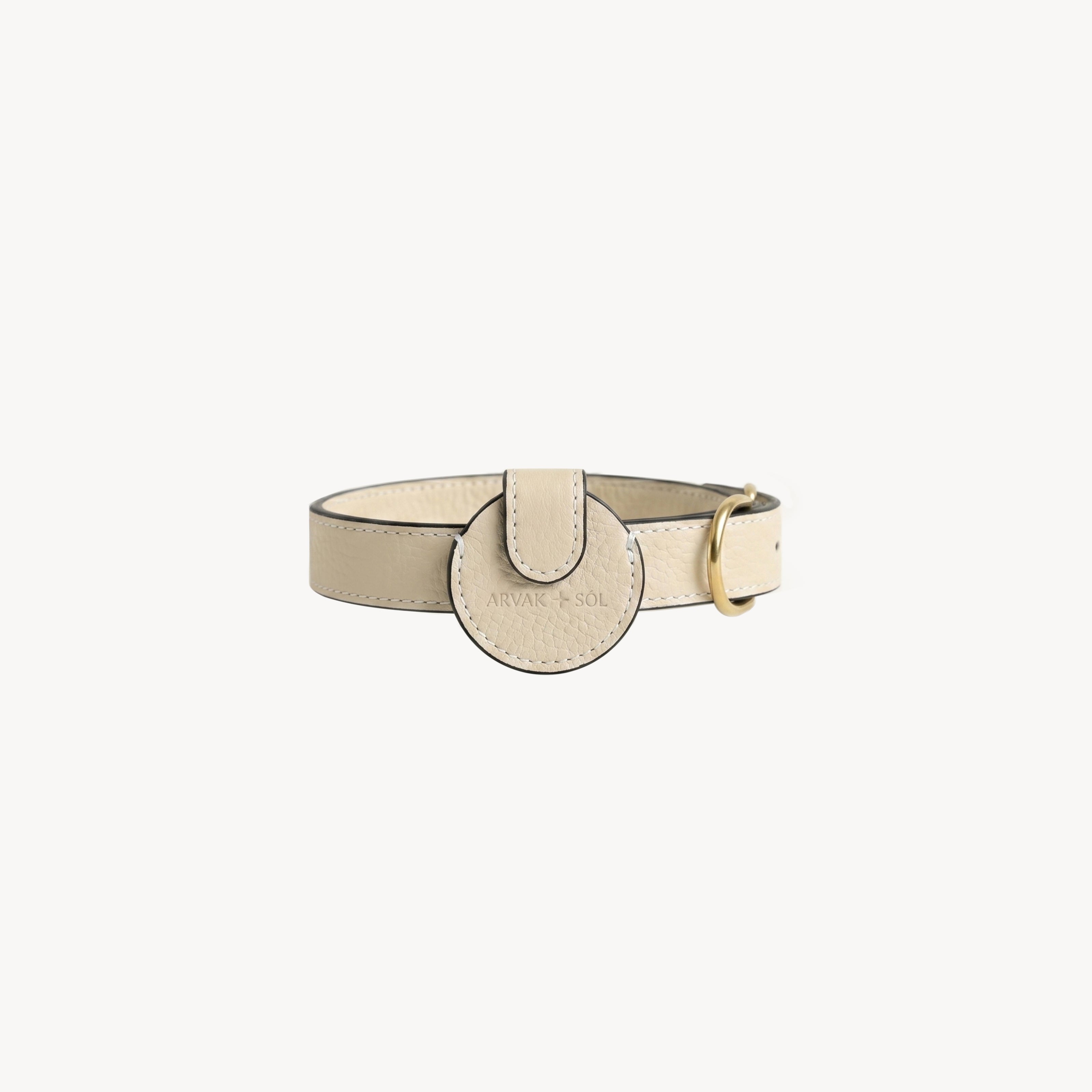 Cream leather Not Your Classic Collar Airtag case by Arvak + Sól, designed to hold and protect your AirTag.