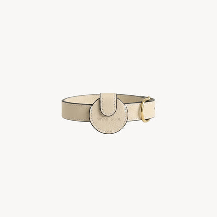 Cream leather Not Your Classic Collar Airtag case by Arvak + Sól, designed to hold and protect your AirTag.