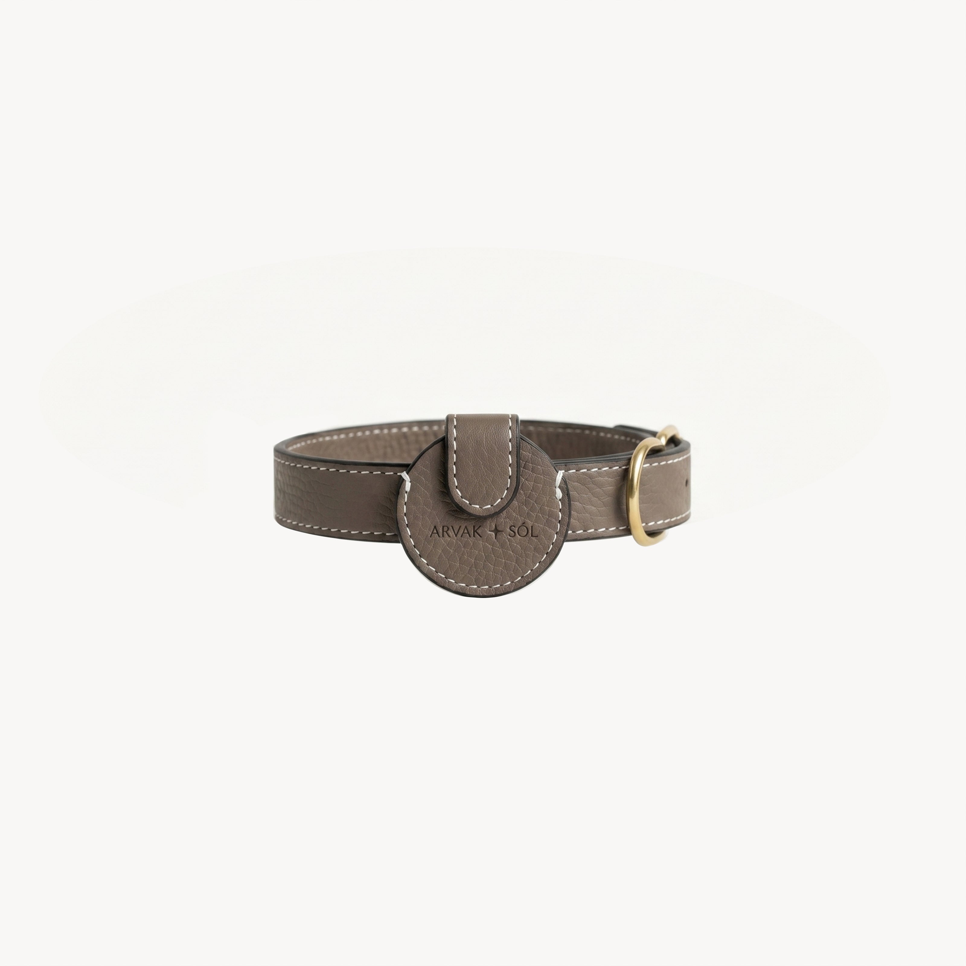 Arvak + Sól Not Your Classic Collar Airtag case in taupe, showcasing a stylish, durable collar accessory with brand logo detail.