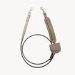 Arvak + Sól hands-free leash and folding wallet set in taupe, featuring a cross-body leash and compact wallet for convenient carrying.