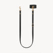 Black wrist and lead set by Arvak + Sól featuring a double-ended leash, cuff bracelet, and adjustable straps.