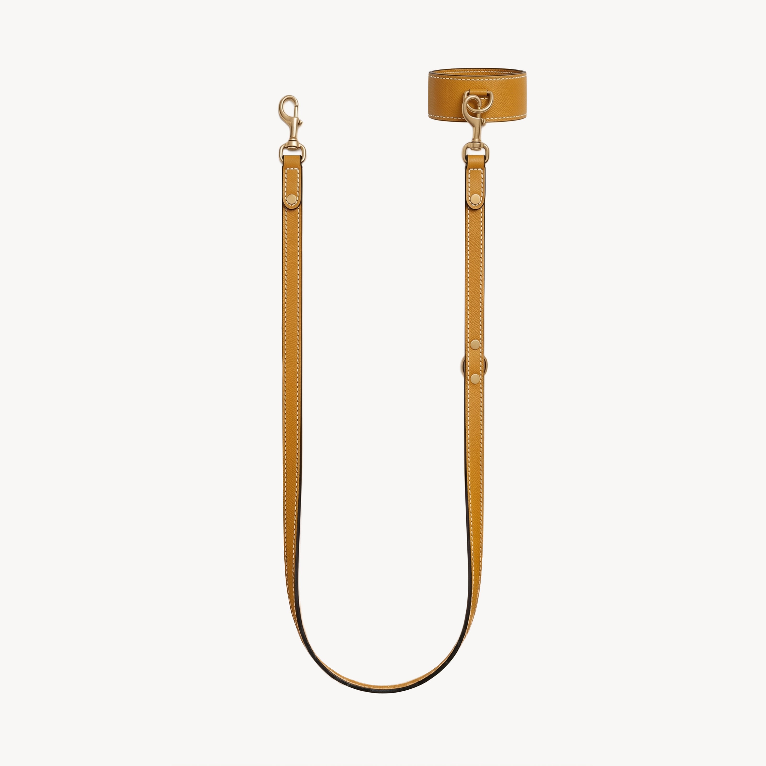Mustard wrist and lead set by Arvak + Sól featuring a double-ended leash, cuff, and bracelet in a stylish design.