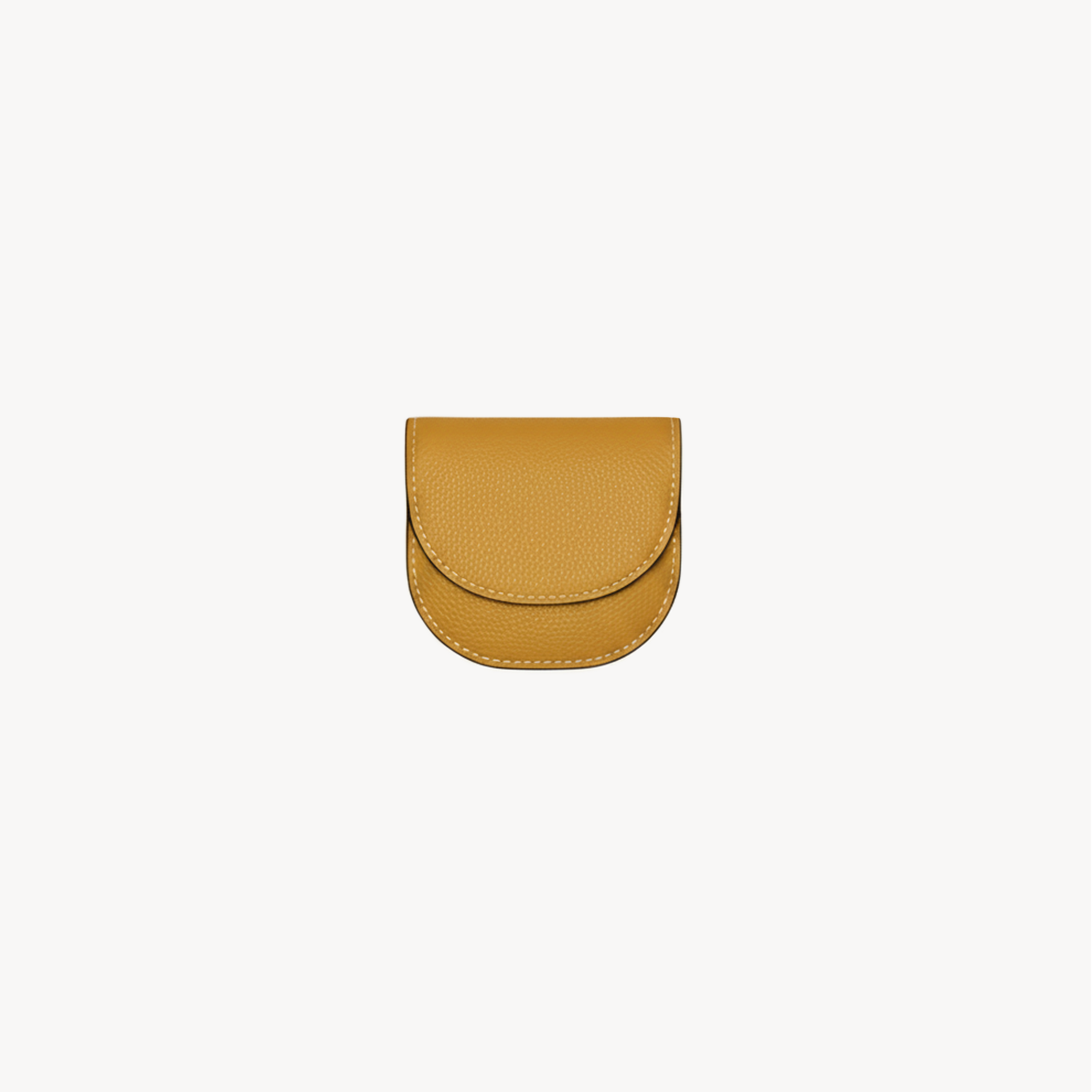 Mustard yellow Arvak + Sól folding waste bag holder with compact wallet design and built-in clip for easy attachment.