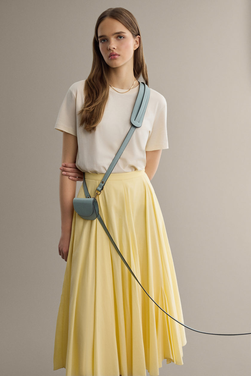 Hands-free leash and folding wallet from Arvak + Sól, showing compact design with handle and wallet folded open.
