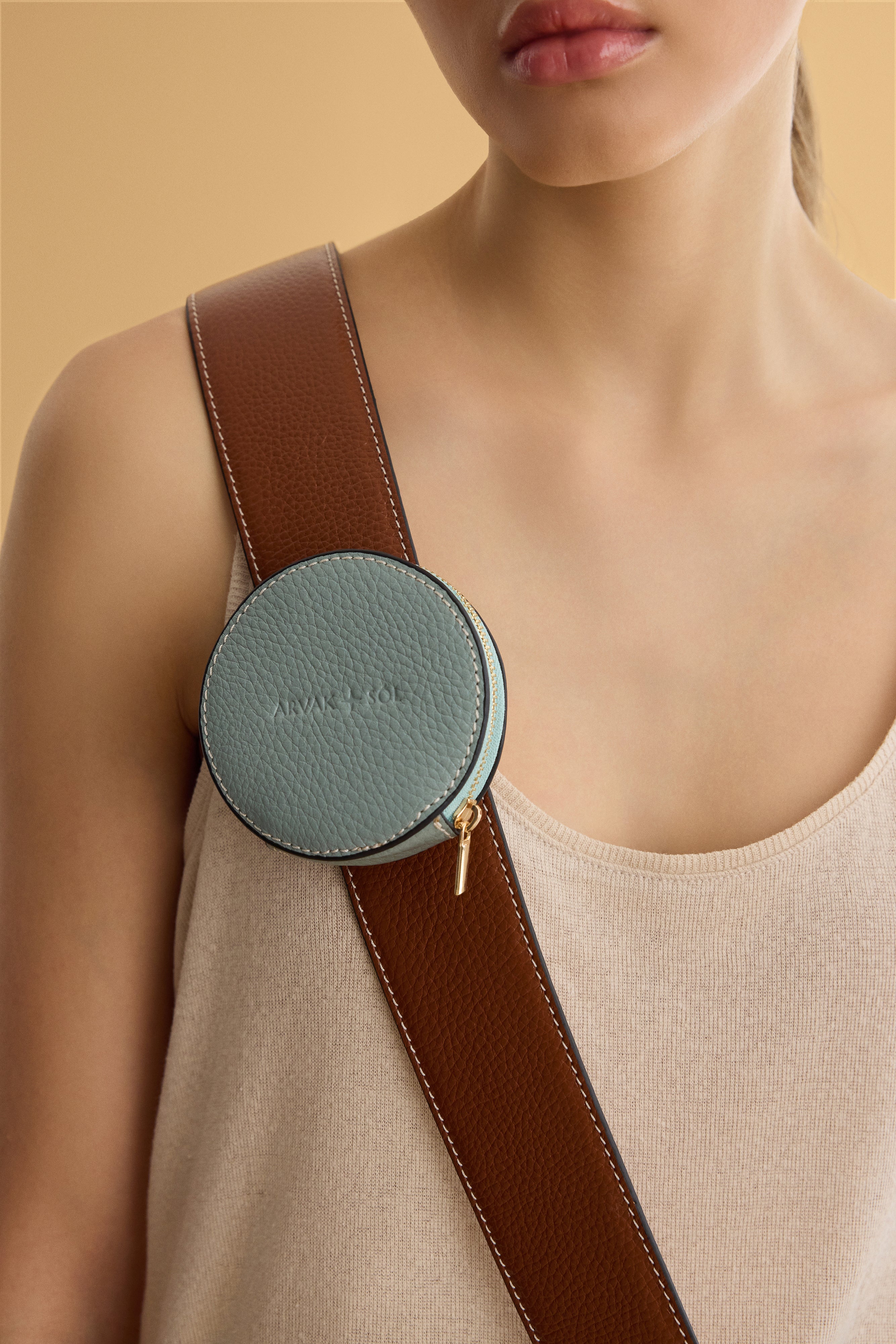Round waste bag holder by Arvak + Sól, featuring a sleek design with a durable metal frame and easy-to-use attachment.